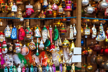 Beautiful decoration. Shopping on traditional Christmas market in european city. Illumination and decorations. Traditional christmas market in the historic center. Festive fair on background.