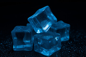 ice cubes in water droplets in blue light