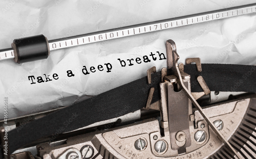 Aufkleber text take a deep breath typed on retro typewriter