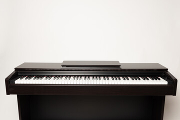 young man playing piano on the white background