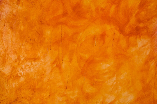 Textured wall brushed painted Background, Abstract Orange Oil Color. © Charlie's