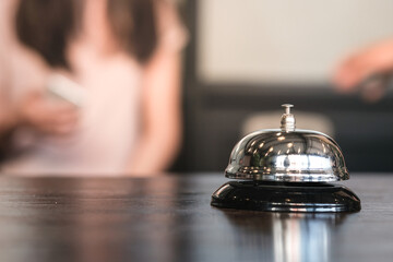 Hotel reception counter desk with service bell.