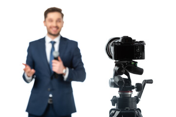 selective focus of digital camera near news anchor on blurred background isolated on white