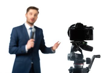 selective focus of digital camera near anchorman on blurred background isolated on white