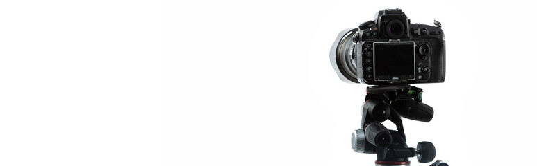 professional photo camera isolated on white with copy space, banner
