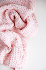 soft voluminous luxury pink towel on a white background