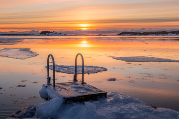 Location for ice swimming. Shot early in the morning with rising sun.