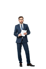 full length view of young businessman looking at camera while holding document on white