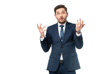 shocked businessman gesturing while looking at camera isolated on white