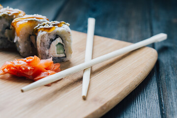 japanese cuisine sushi sauce chopsticks wood board