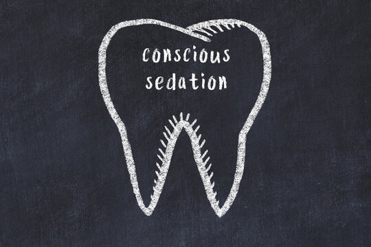 Chalk drawing of a tooth with medical term conscious sedation. Concept of learning stomatology