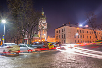 Night Lviv old city architecture in the winter season. Buildings highlighted by the illumination