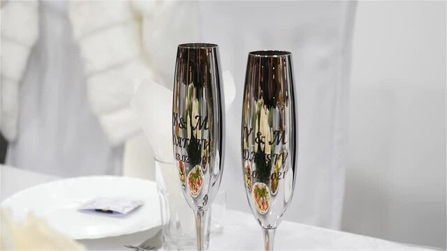 Glasses for brides with their initials and date of marriage.