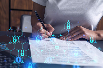 A businesswoman in casual wear signing the contract to prevent probability of risks in cyber...
