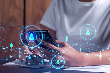 Employee signing the contract to boost her career and gain new opportunities in personal growth. Women in business concept. Checking the detail of the deal at smartphone. Social media hologram icons