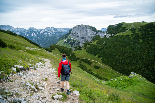 A young female hiker does trail hiking to the top of the Loser Mountain in the Styria region in Austria.