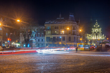 Night Lviv old city architecture in the winter season. Buildings highlighted by the illumination