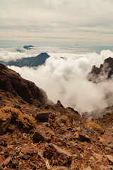 Impressive landscape of clouds and volcanic mountains from the top of the Roque de los Muchachos viewpoint, on the island of La Palma, Canary Islands, Spain.