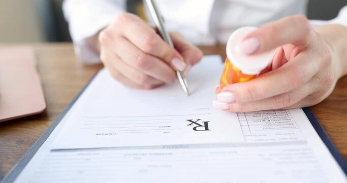 Doctor writes prescription for medicine 4k movie. Getting prescription for medicines in medical facility concept