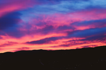 sunrise in the mountains, autumn theme sky, dark atmosphere
