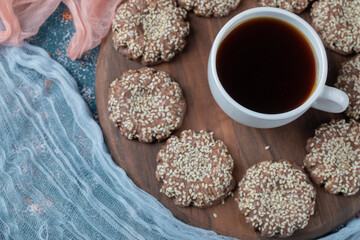 Ginger sesame cookies on a wooden platter