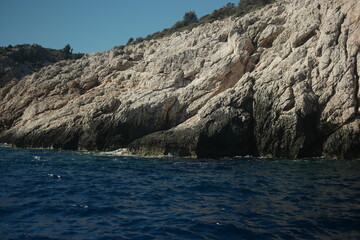 Sandstone rock formation at Mediterranean sea coast. Large rocky cliff over the ocean. Amazing...