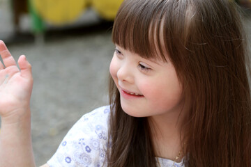 Portrait of beautiful young girl on the playground.
