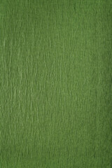 Green wrapping paper close-up. Green textured background. Vertical frame