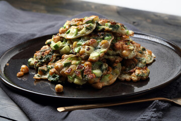 Homemade vegetable pancakes with chickpea, zucchini and mint leaves