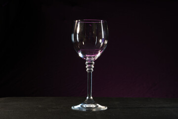 empty wine glass on black background