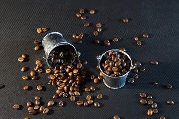 Naklejka premium coffee grains and a small bucket. Coffee Bucket Concept