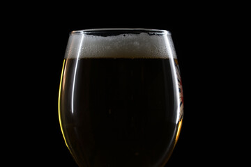 beer glass with beer on black background 