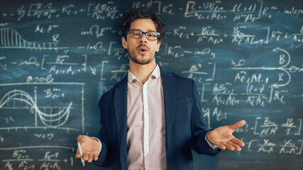 Online e-Education Concept: Teacher Explains Lesson to Classroom, Behind Him Blackboard with Writing. e-Learning, Online Courses: Lecturer does Video Call, Explains Subjects to Students