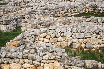 ruins of ancient walls on the site of a destroyed ancient city