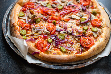 vegetable pizza tomato, pickles, mushroom, olives vegan or vegetarian no meat on the table healthy snack top view copy space food background
