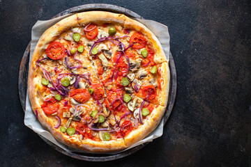 vegetable pizza tomato, pickles, mushroom, olives vegan or vegetarian no meat on the table healthy snack top view copy space food background