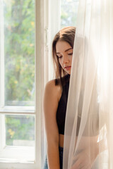 Fototapeta premium Young woman relaxing at home