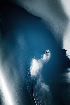 A man is powder skiing in British Columbia, Canada.