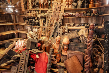 Handmade wooden souvenirs, boxes, boards and figurines displayed at local market inside one of...