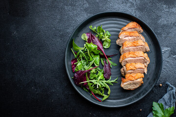 duck breast grill meat fried mix salad leaves barbecue roasted poultry on the table snack top view...