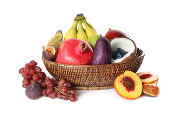 Assortment of fresh exotic fruits in basket on white background