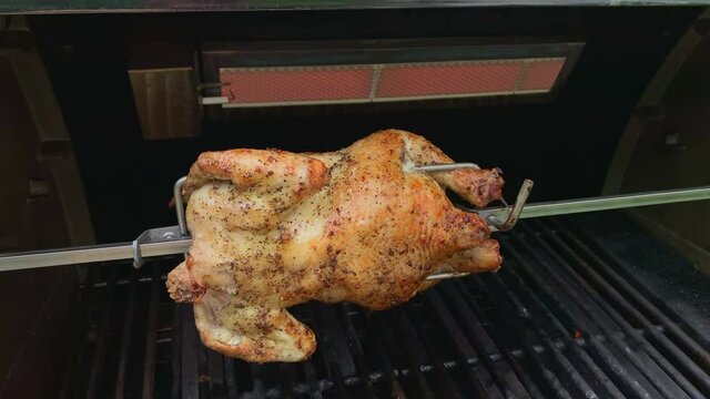 Whole Chicken Roasting on Rotisserie Spit