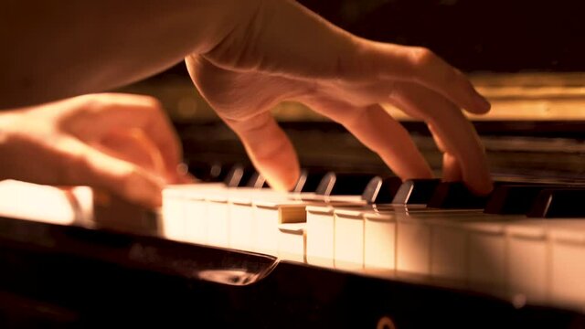 Woman pianist playing the piano at a concert