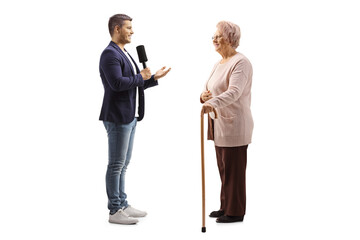 Young male reporter interviewing an elderly citizen