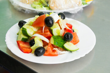 serving salad. Creation of an author's salad in a restaurant 