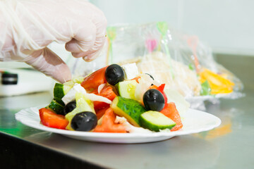 serving salad. Creation of an author's salad in a restaurant 