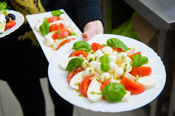 serving salad. Creation of an author's salad in a restaurant 