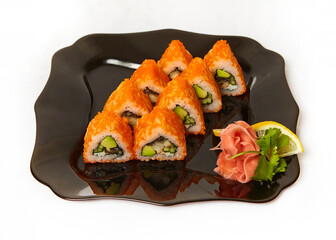 Sushi on black plate on white background