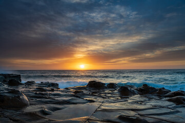 High Cloud Sunrise Seascape from Rock Platform