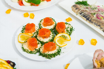 serving salad. salad in a restaurant on a table with a white tablecloth. Table served with dishes for the holiday 
